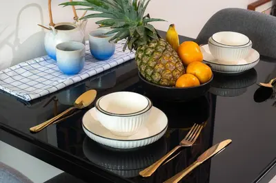 a table with a bowl of fruit on top of it at Luxury Art apt Downtown Metro Bangkok-Kitchen-living room in Bangkok