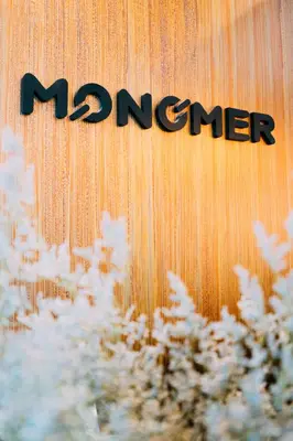 a marner sign on a wooden wall with snow at Monomer Hostel Bangkok in Bangkok