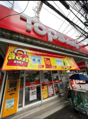 a store with a sign on the front of it at 109 Homely Apartment Free Wi-Fi Near BTS in Bangkok