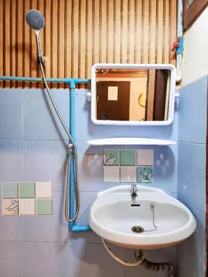 a bathroom with a sink and a shower at 109 Homely Apartment Free Wi-Fi Near BTS in Bangkok