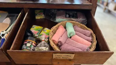 a wooden box with towels and other items in it at Baan YentaFo - Pink House 2nd floor in Chinatown