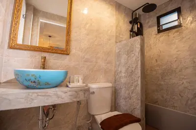 a bathroom with a sink and a toilet at JB Home Bangkok - Victory monument in Bangkok