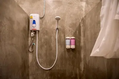 a shower in a bathroom with a shower at silom Dream catcher rainbow hostel in Bangkok