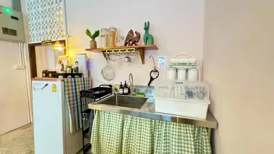 a kitchen with a sink and a counter top at Baan YentaFo - Pink House 4th floor in Chinatown