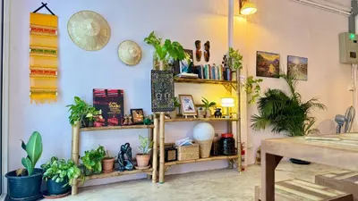 a room filled with shelves filled with plants at Baan YentaFo - Pink House 4th floor in Chinatown