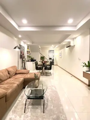a living room with a couch and a table at 4Beds 4Baths New Renovated Entire House BTS Ekkamai in Bangkok