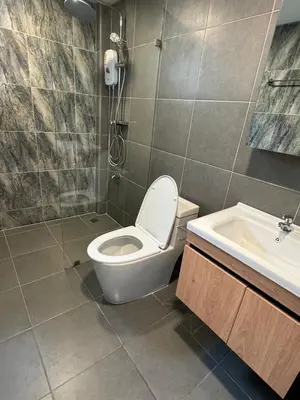 a bathroom with a toilet and a sink at 4Beds 4Baths New Renovated Entire House BTS Ekkamai in Bangkok