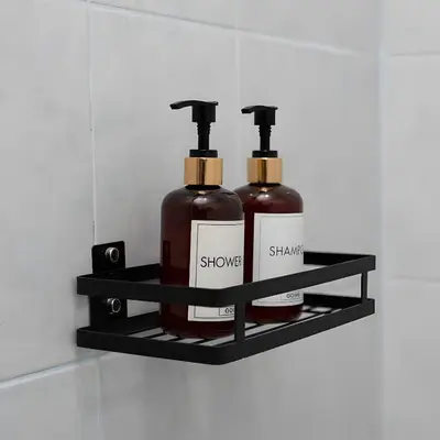 a shelf with two bottles of soap on it at Elite Hotel Nana Sukhumvit 3 in Bangkok