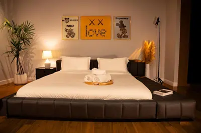 a bedroom with a large bed with a towel on it at 943summer villa曼谷中心Asok&Tong lor800平海天别墅 in Bangkok