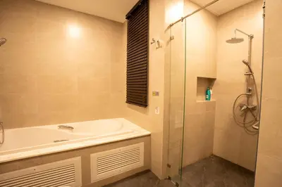 a bathroom with a sink and a shower at 943summer villa曼谷中心Asok&Tong lor800平海天别墅 in Bangkok