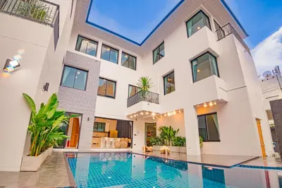 a house with a swimming pool in front of it at 943summer villa曼谷中心Asok&Tong lor800平海天别墅 in Bangkok