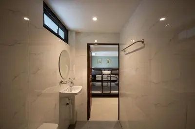 a bathroom with a sink and a mirror at Arttra Villa in Bang Chak