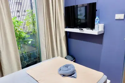 a hat sitting on a table in a room at Sleep cafe @ Hidee in Bangkok