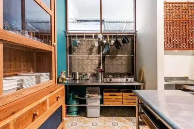 a kitchen with a sink and a counter top at Sleepinn Bang Chak in Bangkok