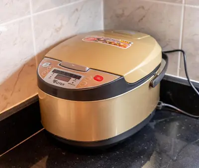 a slow cooker sitting on a counter in a kitchen at BUA Suite Sukhumvit, Nana BTS in Bangkok