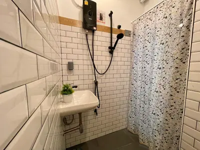 a bathroom with a sink and a shower at Great relaxing in oldtown, Entire floor, near Grand Palace in Bangkok