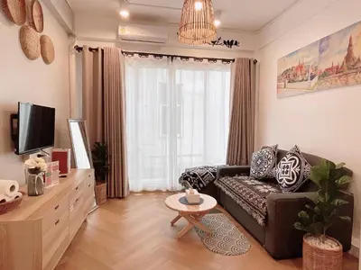 a living room with a couch and a tv at Great relaxing in oldtown, Entire floor, near Grand Palace in Bangkok