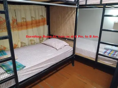 a bedroom with two bunk beds in a room at Sleep at home hostel in Bangkok