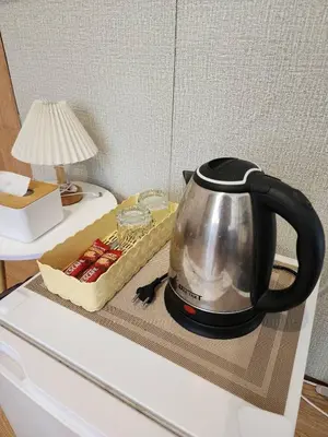 a tea kettle sitting on top of a counter at 207-Olan Place Homely room Free Wi-Fi and Near BTS line in Bangkok