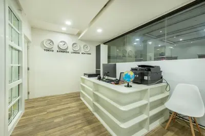a office with a counter with a printer on it at Neom Town Residence in Bangkok