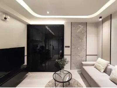 a living room with a couch and a tv at Luxe Design l Wellness & Tropical Retreat l No fee in Bangkok