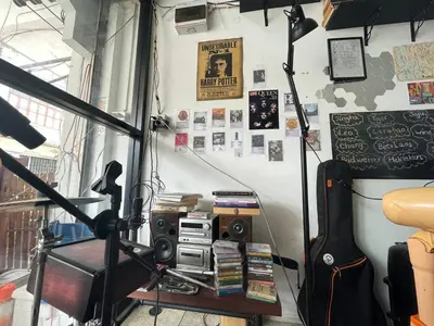 a recording studio with a guitar and a keyboard at Happy Hope in Bangkok