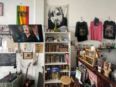 a room with a book shelf filled with books at Happy Hope in Bangkok