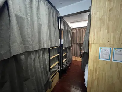 a room with two bunk beds and a window at Happy Hope in Bangkok