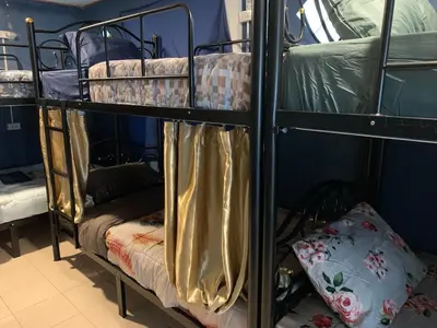 a couple of bunk beds in a room at White House Hostel Khaosan in Bangkok