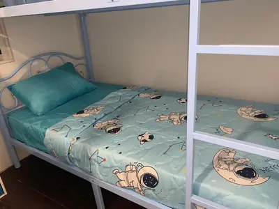 a bedroom with a bunk bed with a hello kitty comforter at White House Hostel Khaosan in Bangkok