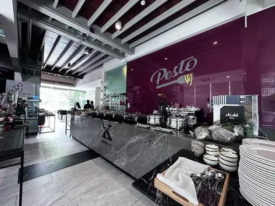 a restaurant with a counter with a counter at S87-7052 BTS Onnut High Floor Gym Swim Good View in Bangkok
