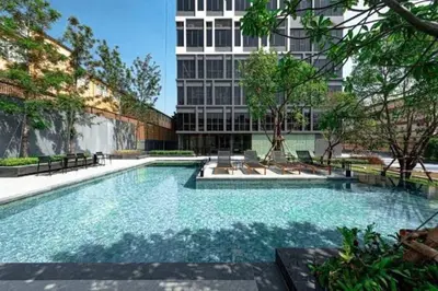 a large swimming pool in front of a building at S87-7052 BTS Onnut High Floor Gym Swim Good View in Bangkok