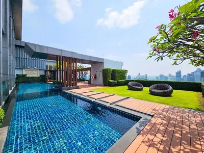 a swimming pool in front of a building at The Address 28 in Bangkok