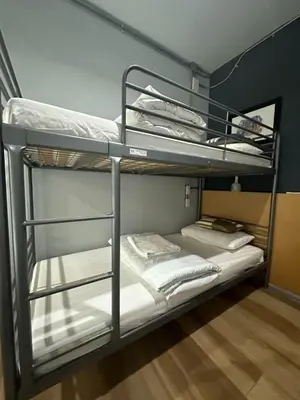 a couple of bunk beds in a room at Bangkok Chat box Hostel in Bangkok