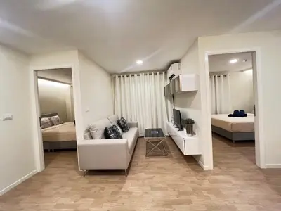 a living room with a couch and two beds at The Forest Building A-more than3nights stay-self checkin checkout in Bangkok