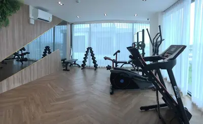 a gym with treadmills and exercise equipment in a building at The Forest Building A-more than3nights stay-self checkin checkout in Bangkok