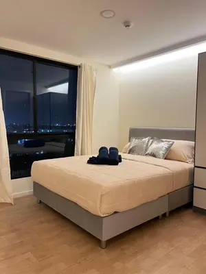 a bedroom with a bed and a large window at The Forest Building A-more than3nights stay-self checkin checkout in Bangkok