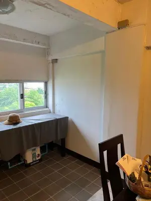 a room with a table and a window at Mahasap Ramindhra next to MRT Station in Bang Khen
