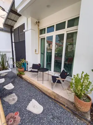 a front porch of a house with chairs and tables at Be Cute#บ้านพักเหมาหลัง 6 ท่าน เด็ก0-7ขวบพักฟรี 2 ท่าน in Ban Khung Taphao