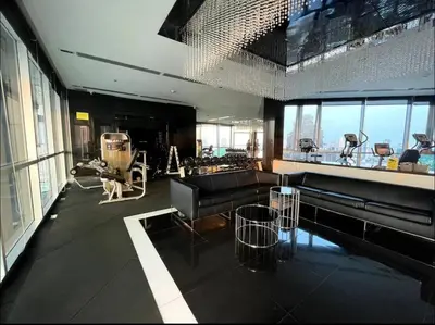 a living room with a couch and tables in a building at Luxurious Downtown River View chao phraya river in Bangkok
