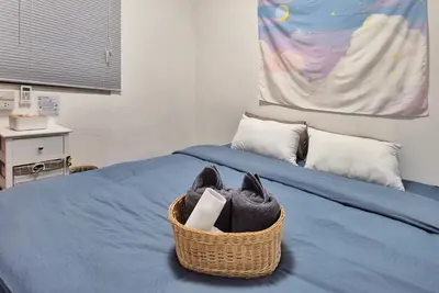 a basket of shoes sitting on top of a bed at Townhouse at Yaek Lam Sali station for 6 pax in Ban Bang Toei (1)