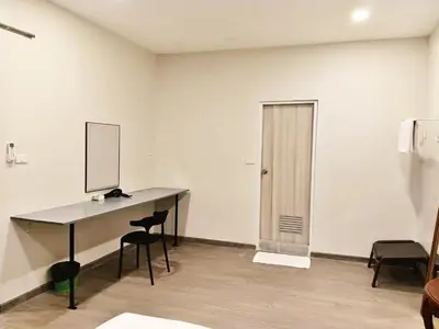 an empty room with a desk with a computer on it at XX HD China Town MRT Dragon Temple in Samphanthawong