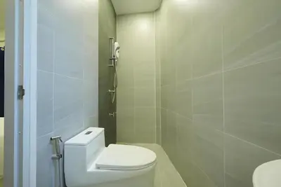 a white bathroom with a toilet and a sink at XX HD China Town MRT Dragon Temple in Samphanthawong