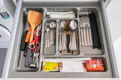 a container filled with utensils and other utensils at 2 BR Suite at BTS NANA Sukhumvit 11 Floor 15 Pool not permitted in Bangkok