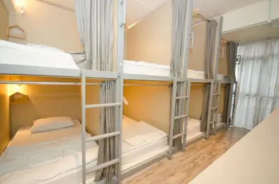 a group of bunk beds in a room at Good Day Hostel in Bangkok