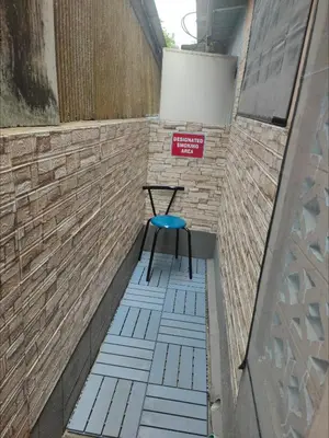 a stool sitting on a walkway in a building at Spacious Studio with Private kitchen near Skytrain in Bangkok