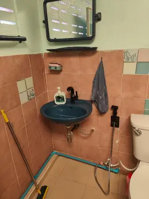 a bathroom with a sink and a toilet at Spacious Studio with Private kitchen near Skytrain in Bangkok