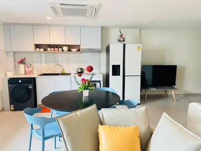 a kitchen and a dining room with a table and chairs at New Ekamai Thonglor Luxury Home near 711, BTS, Mall in Khlong Toei