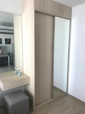 a room with a sliding glass door with a stool at Owow o2 in Bang Chak