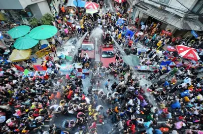 a large crowd of people waiting to cross a street at XX GO INN Khaosan Road BKK โกอินน์ ตรอกข้าวสาร in Bangkok